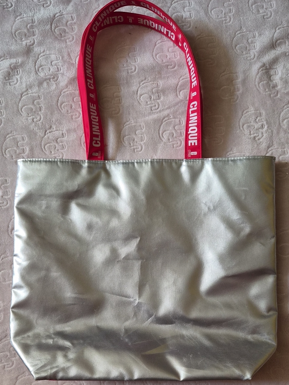 Clinique Metallic Silver Tote with Red Logo Handles